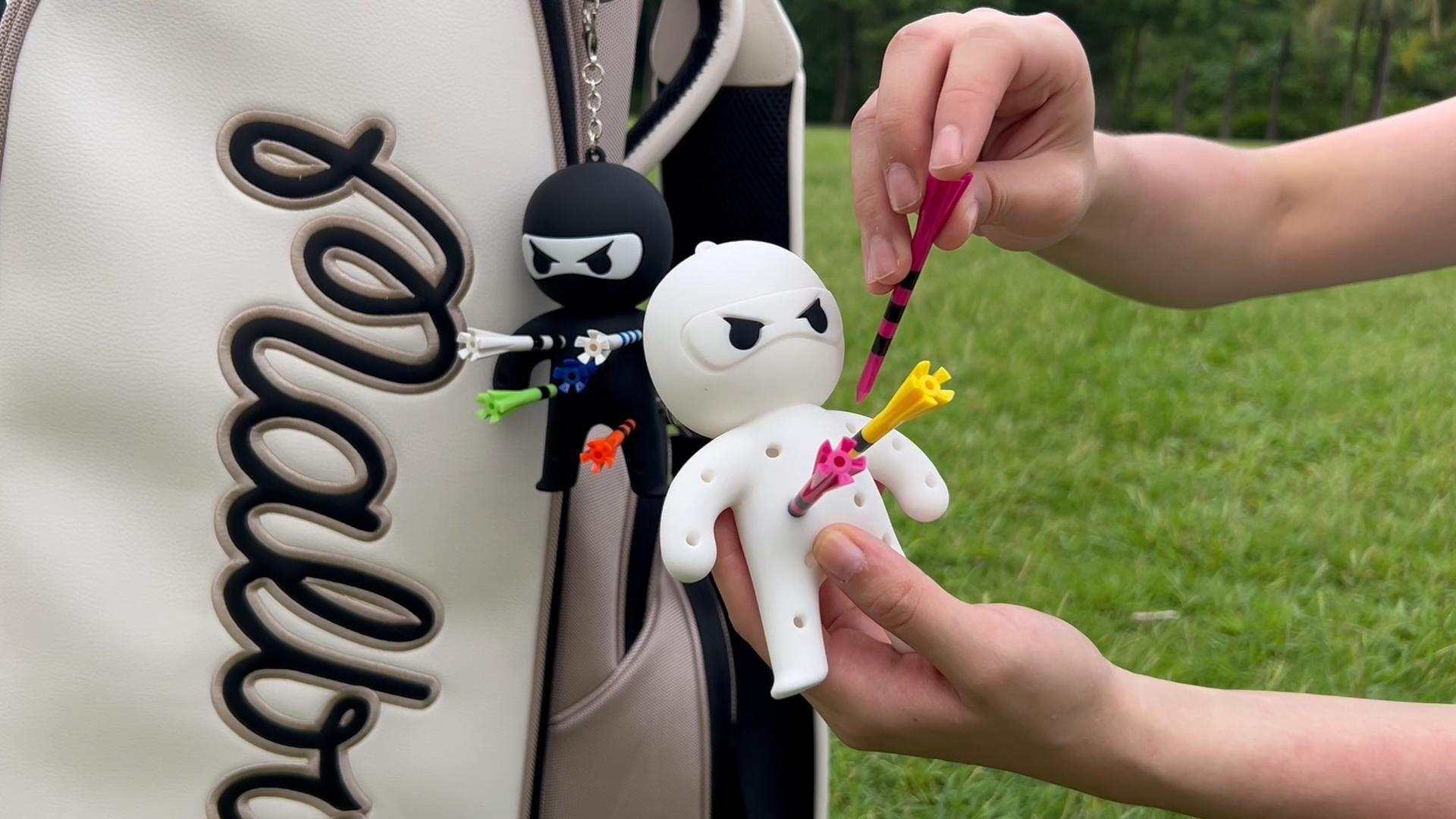 Ninja Charm shown in hand for scale